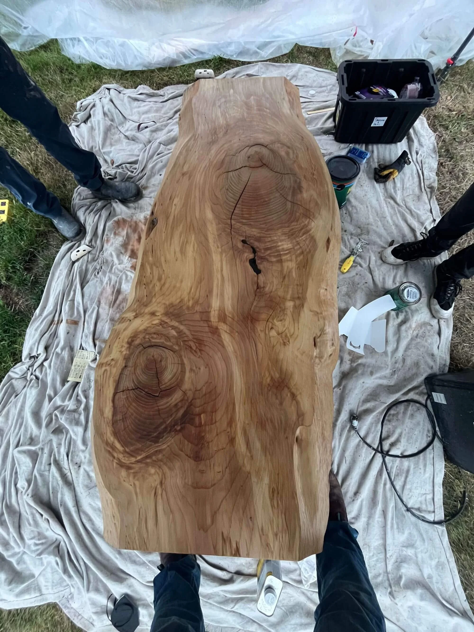 Gold Mountain Contracting crew prepping an older live edge coffee table for refinishing at a Seattle area home.