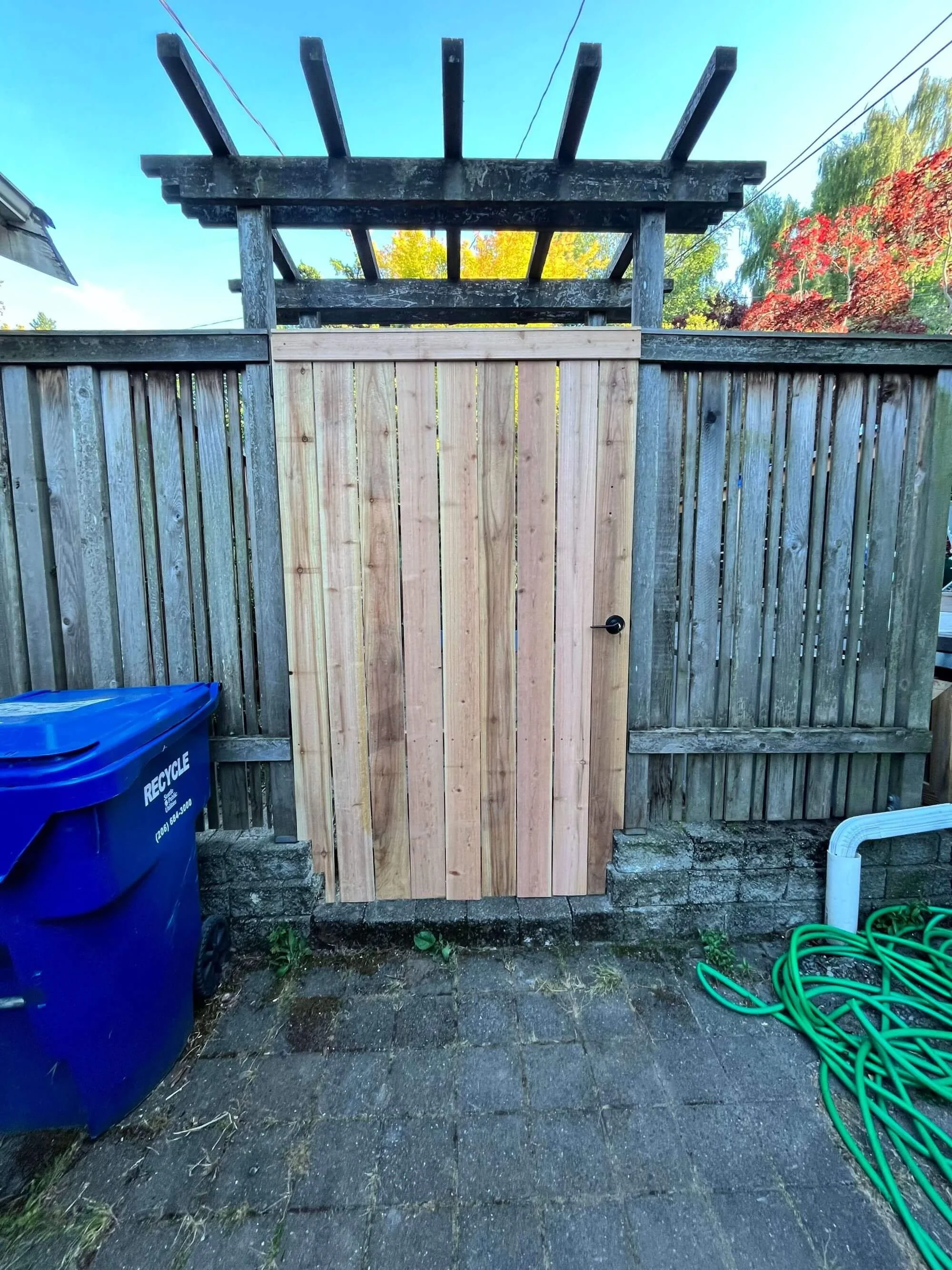 A new custom cedar gate for a homeowner in Normandy Park, WA. Built by Seattle Fencing Contractor, Gold Mountain Contracting.