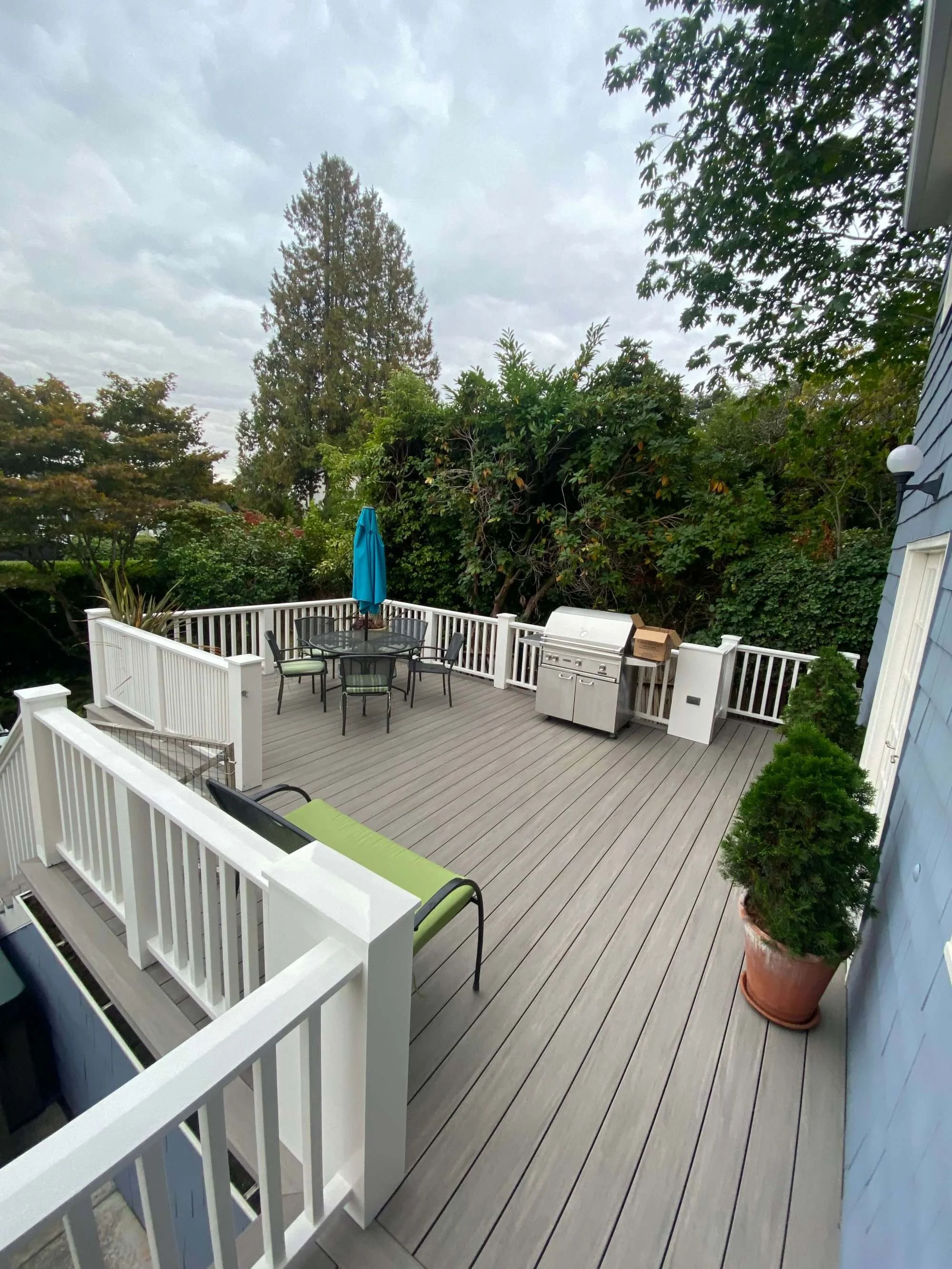 New decking for thrilled homeowners in Normandy Park, WA, installed by local Deck Contractor, Gold Mountain Contracting.