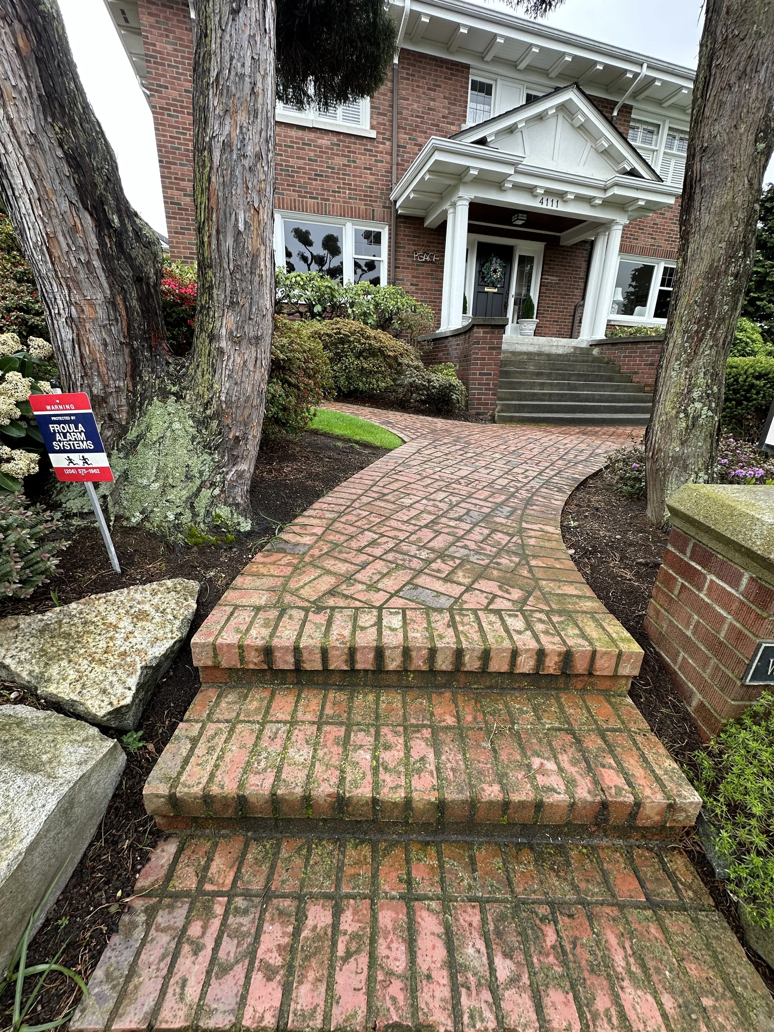 A brick walkway before Gold Mountain Contracting did their pressure washing magic!