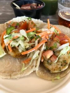   FISHIN FOR BREWS    The Fisherman | Deep Fried Swai taco with cabbage, pico de gallo, and a chipotle spicy sauce.  