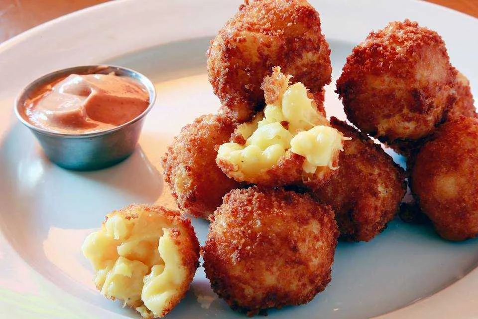   FRED 62    OG flamin Hot mac n cheese Balz | Flamin hot mac n cheese balls: Rajas con crema:roasted poblano chilies/aged white cheddar and jack cheese/ crushed flamin cheetos &amp; F 62 chili powder served with guacamole &amp; roasted tomato salsa 