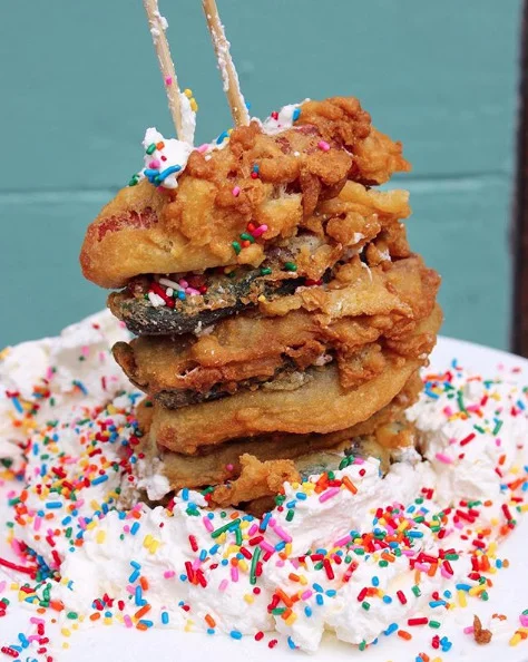 I ♥︎ FUNNEL CAKES Funnel Cake, Vanilla Ice Cream, our Signature Topping Cookie Butter Drizzle, Strawberries, Whipped Cream & Chocolate Syrup then finished with our Homemade Crumb Topping