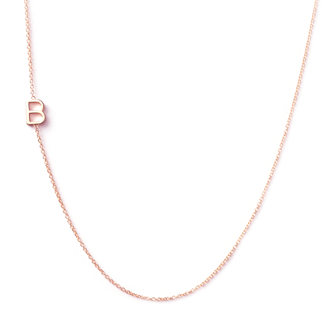 I have this Maya Brenner letter necklace. Greg gave it to me the day Dean was born. It has all four of my boys initials on it. I never take it off. There are many different custom options, and her jewelry is all so delicate but durable.