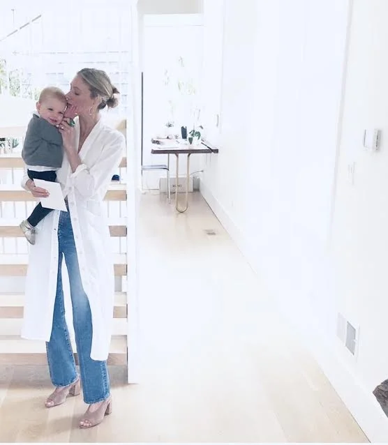 Heather Sullivan at home with her daughter- wearing the jacket dress