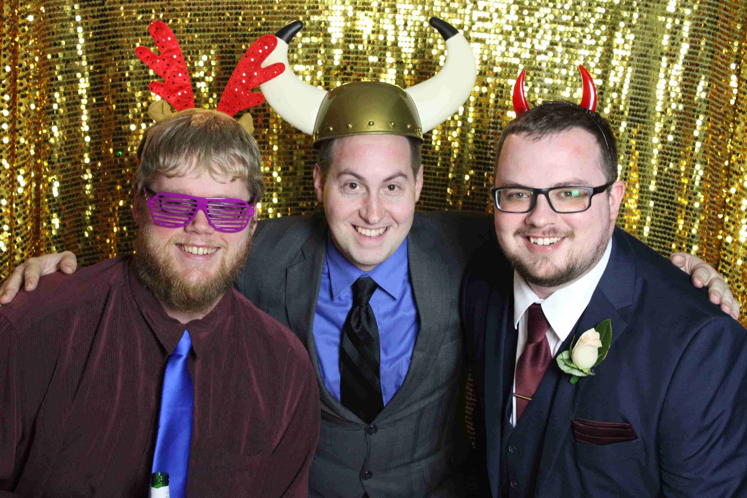 Three guests inside a photo booth at a Melbourne event