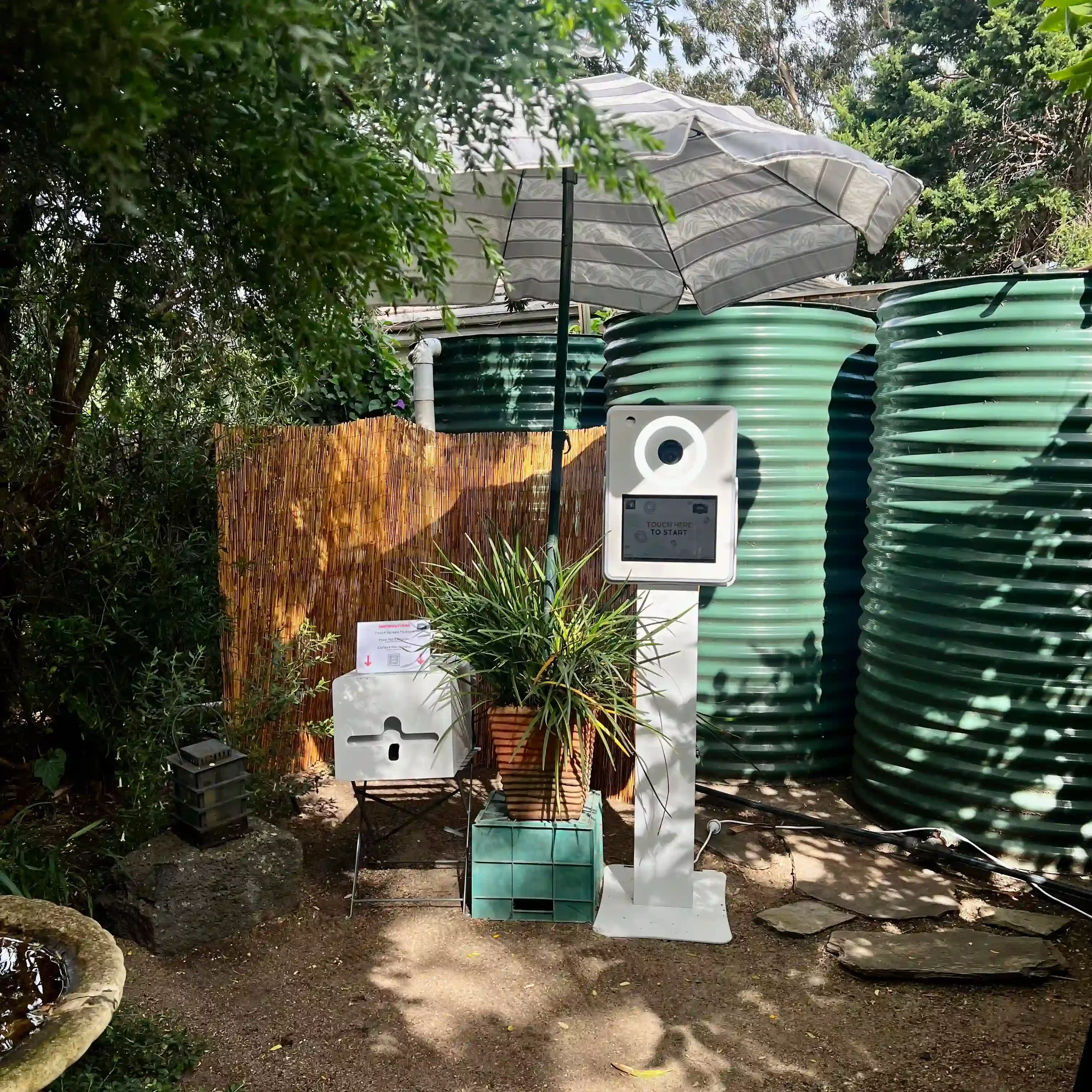 Outdoor open-air photo booth surrounded by greenery — Pixel Booth garden photo booth hire Prahran for weddings and parties.