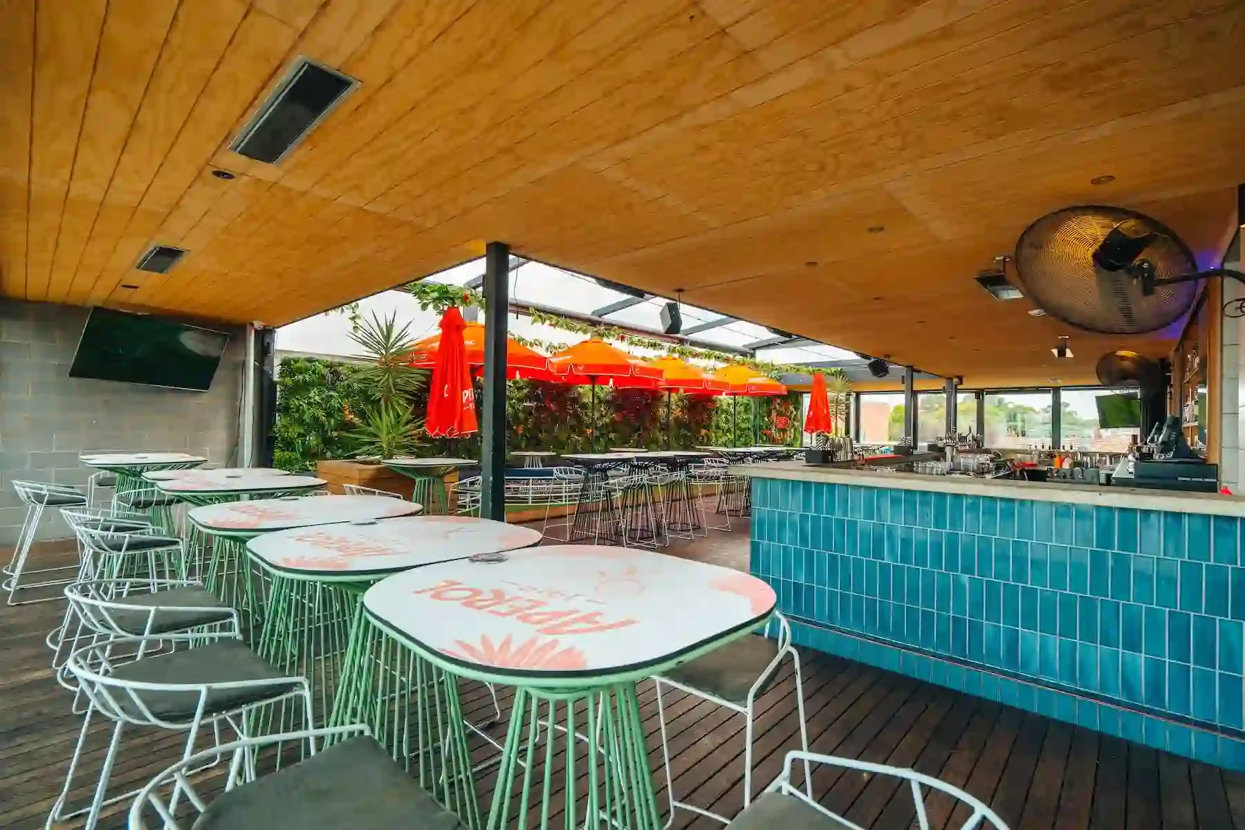 Stylish rooftop bar with open seating and blue-tiled bar — The Osborne Rooftop & Bar South Yarra Melbourne, perfect venue for Pixel Booth photo booth hire, corporate events, and parties.