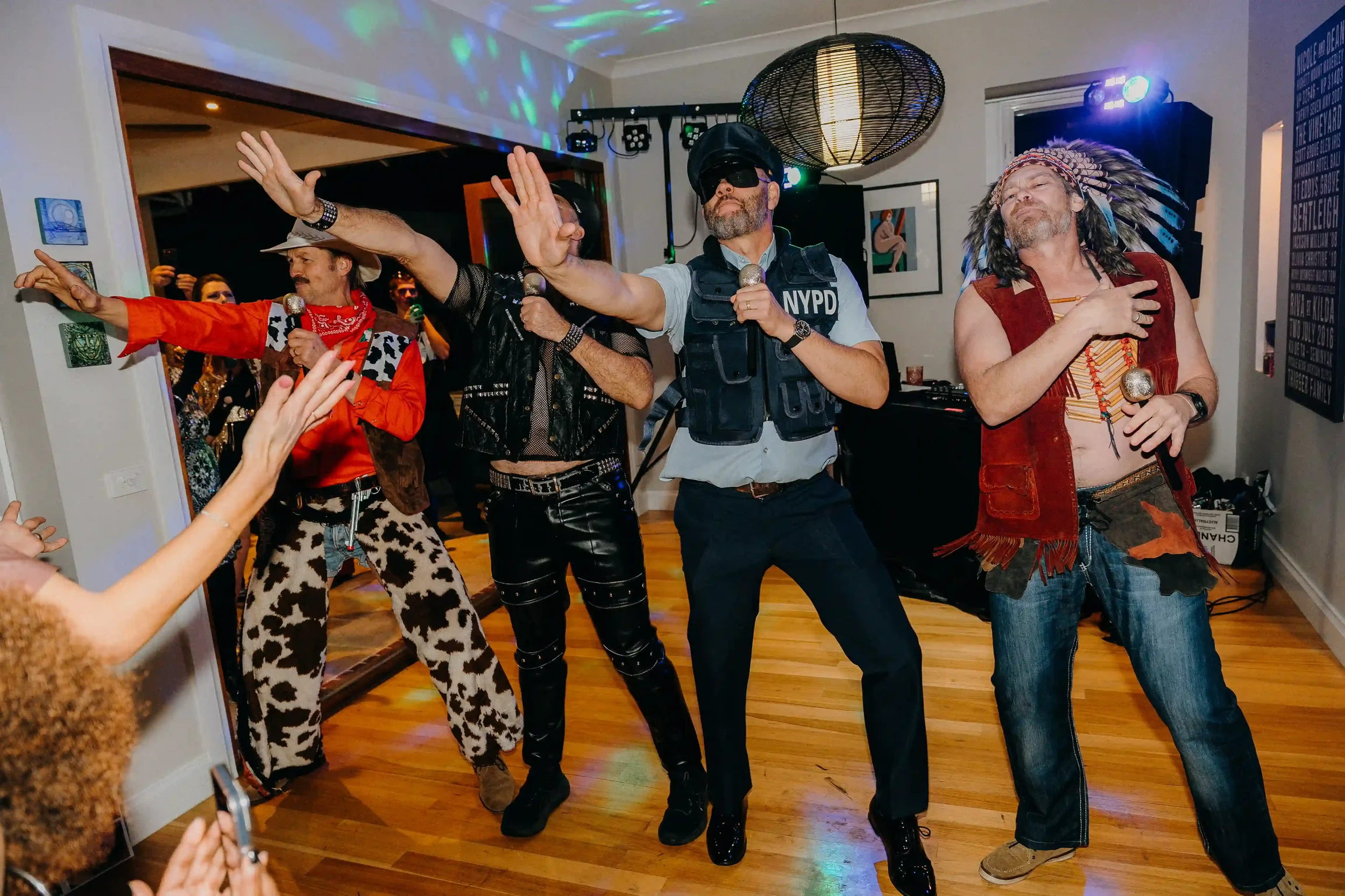 Guests dancing under lights at a Melbourne party — Pixel Booth roaming photographer covering South Yarra events.