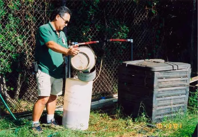 EM® being applied through an injector system for Zoo compost pile