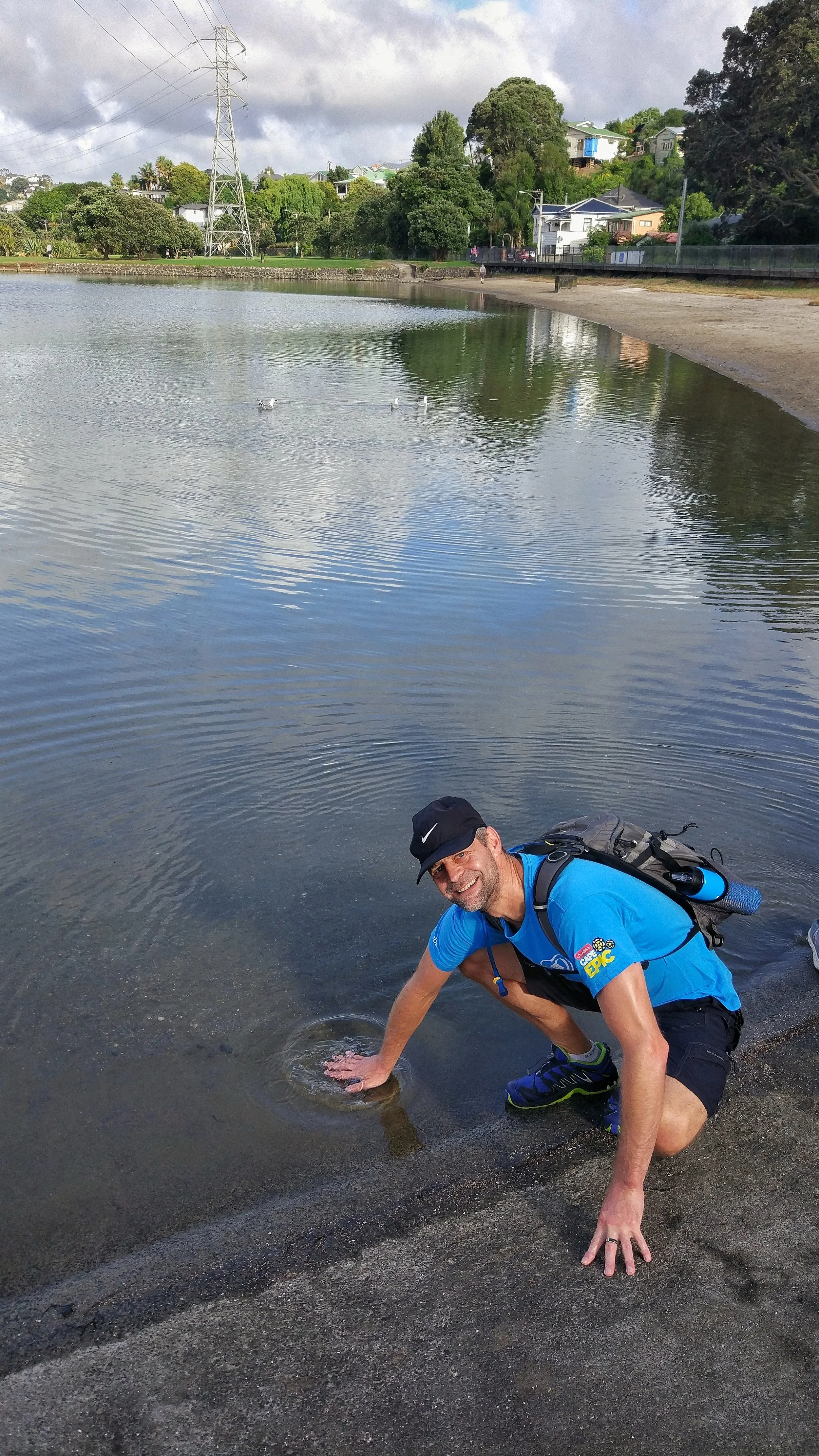 Chris touching the waters of the tasman sea before the start
