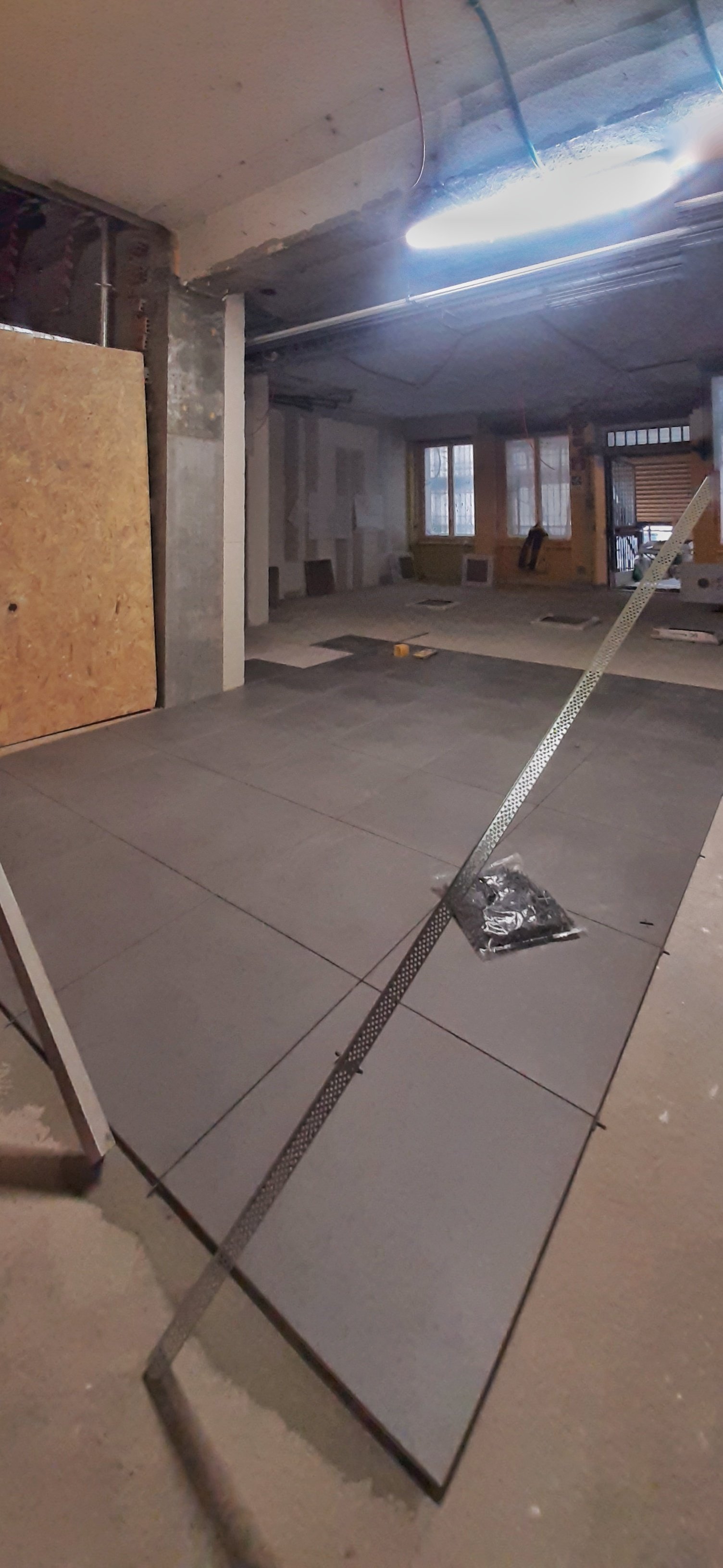 Collegio Einaudi, sezione Mole - Pavimentazione zona accoglienza.