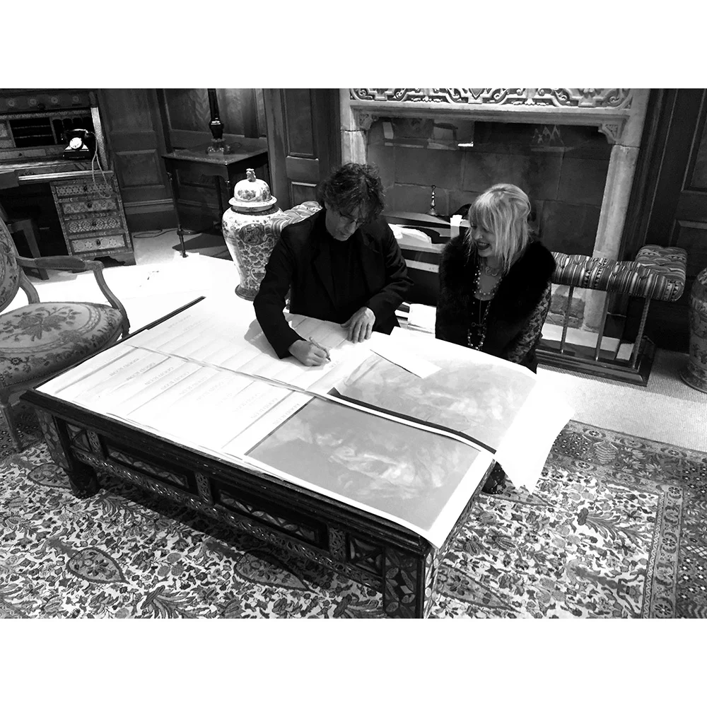 Neil-signing-prints.jpg