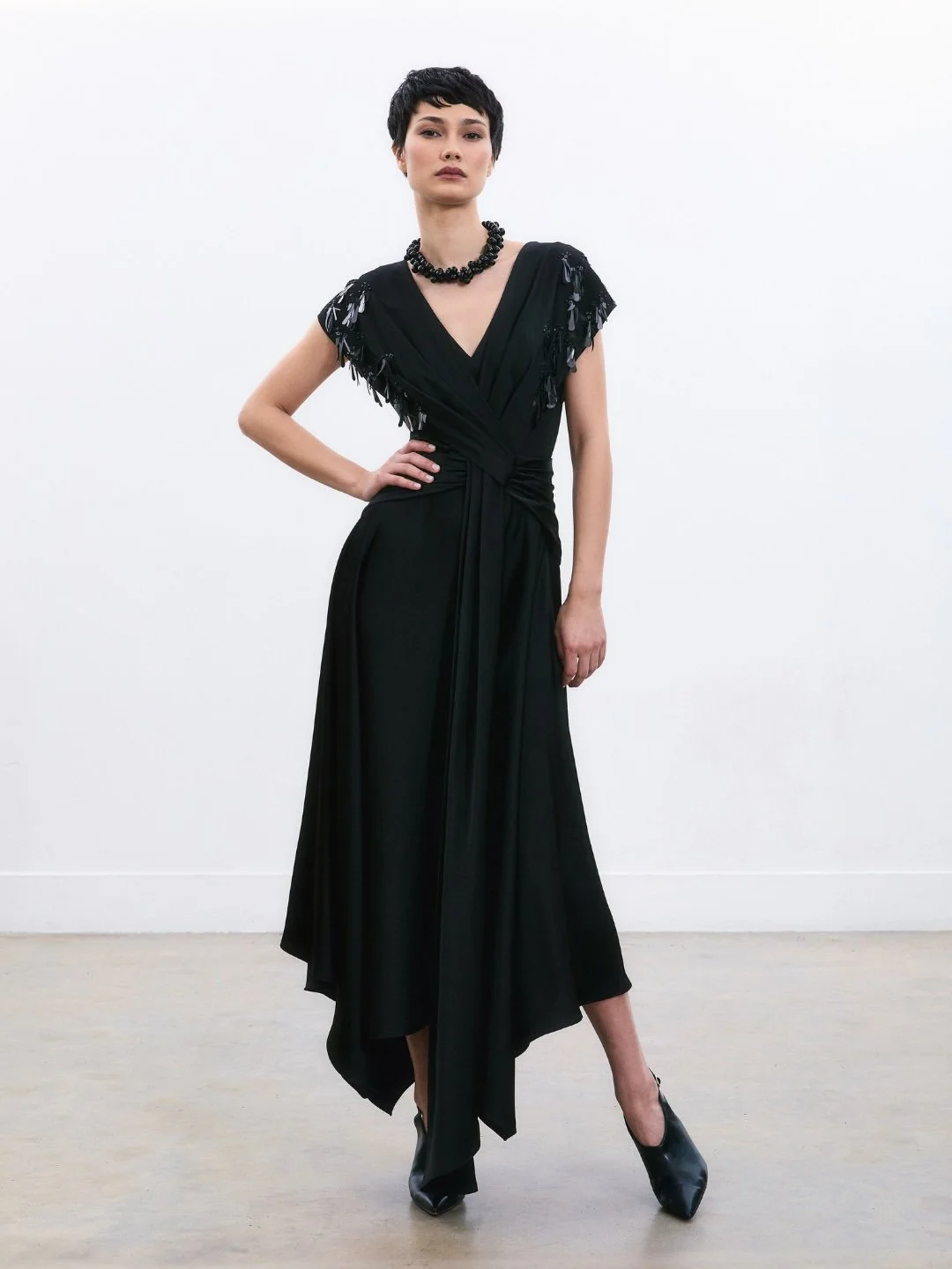 A collection defined by movement and intention.Silhouettes unfold through drape, shaping form wi (2).jpg