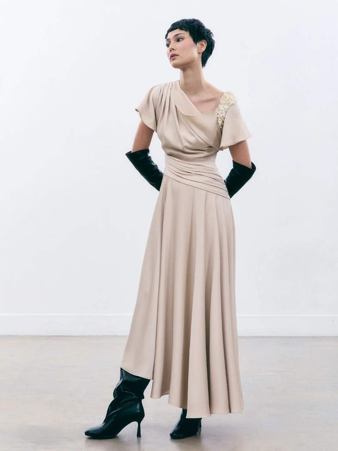 A collection defined by movement and intention.Silhouettes unfold through drape, shaping form wi.jpg