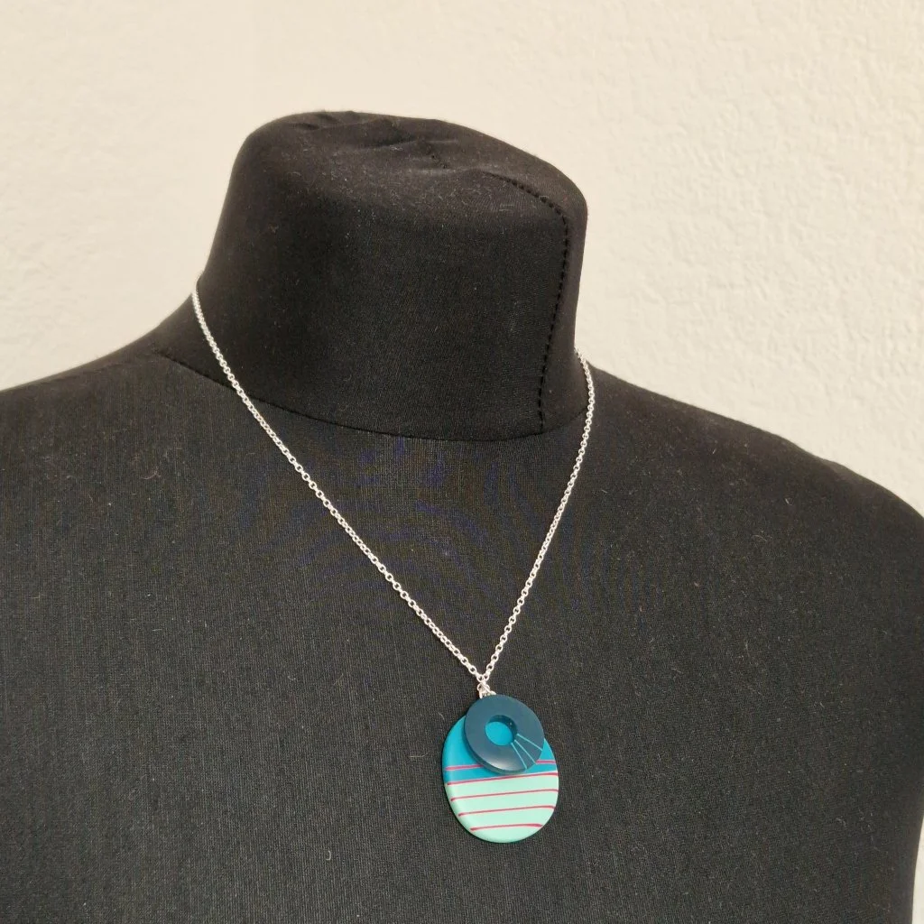 blue-cerise-double-ss-pendant-modelled.jpg