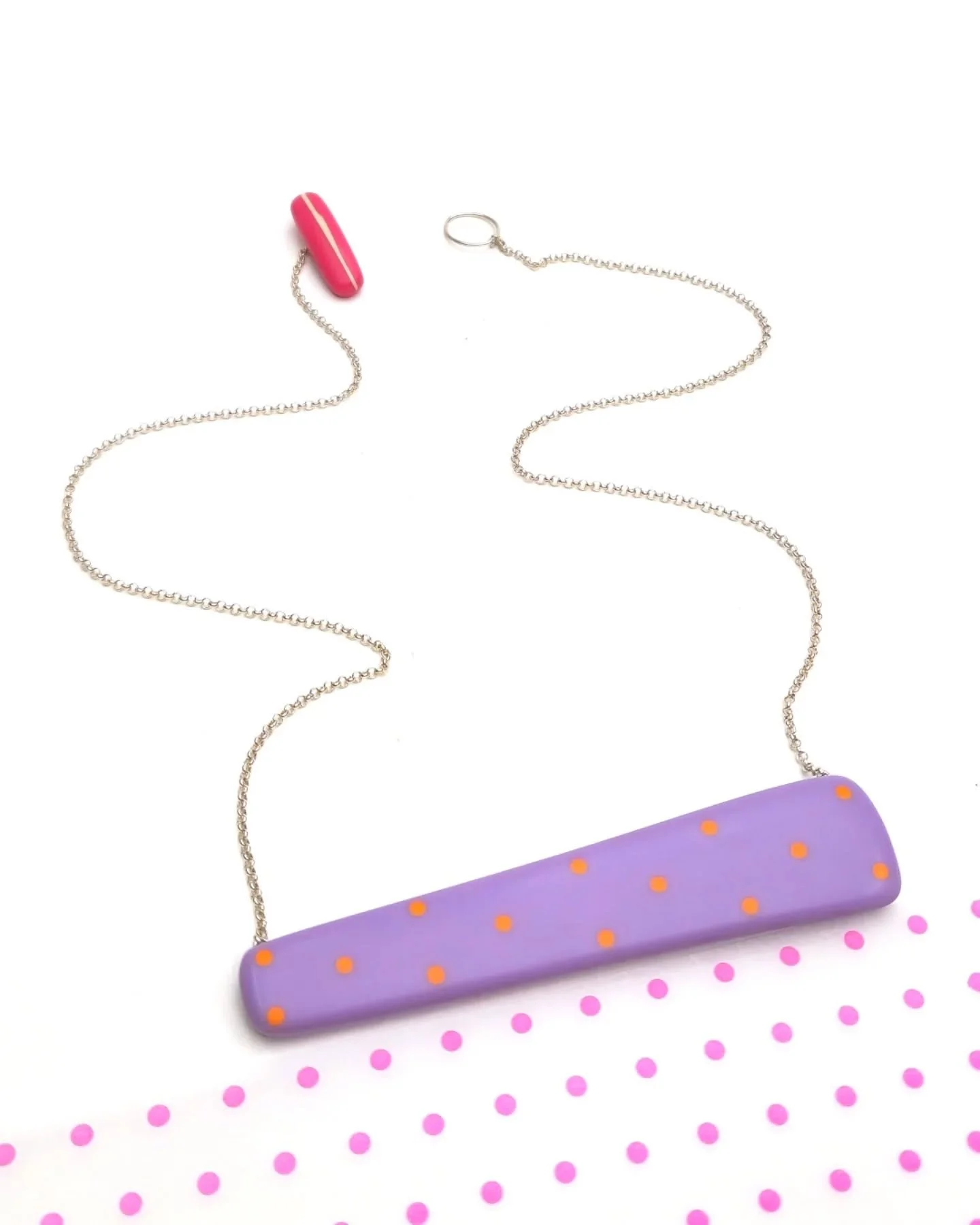 R E V E R S I B L E ! ! ! 

Looking for a pop of colour for your Spring (yes apparently it is Spring 🤣) wardrobe?

This lilac pendant is a gorgeous colour, and even better it's REVERSIBLE!

Clashing orange dots on one side and cerise pink stripes on