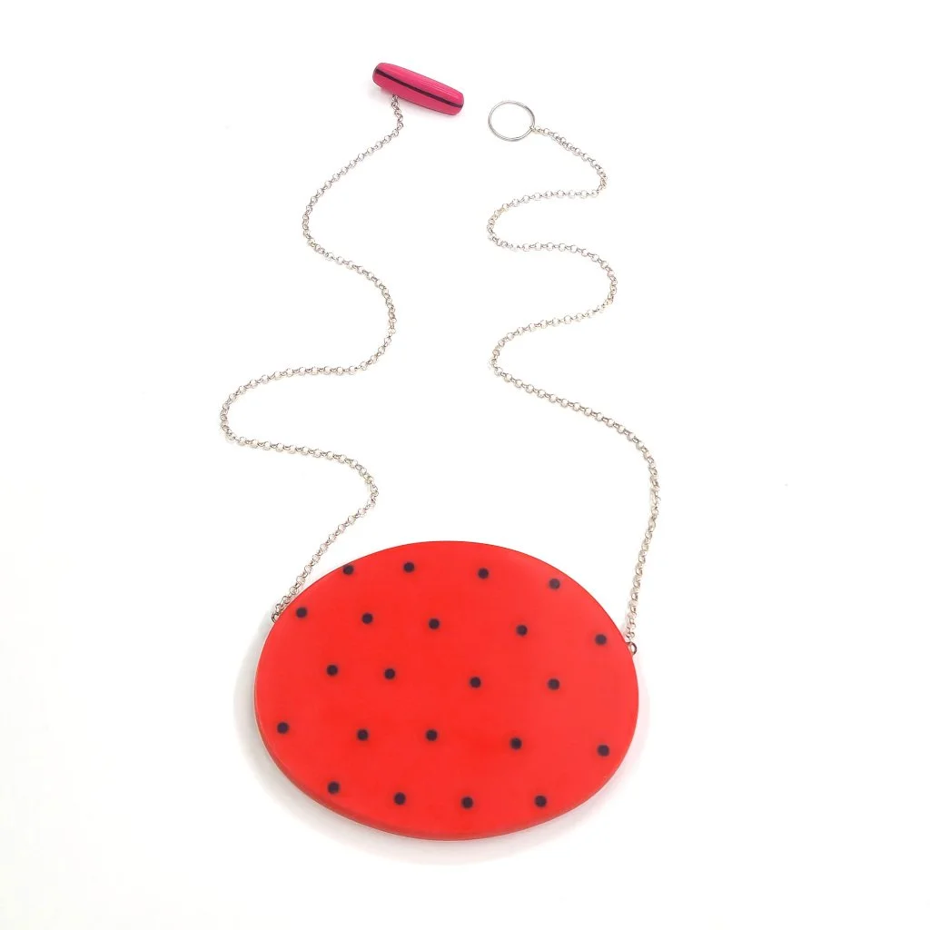 spotty-red-reversible-oval-pendant.jpg