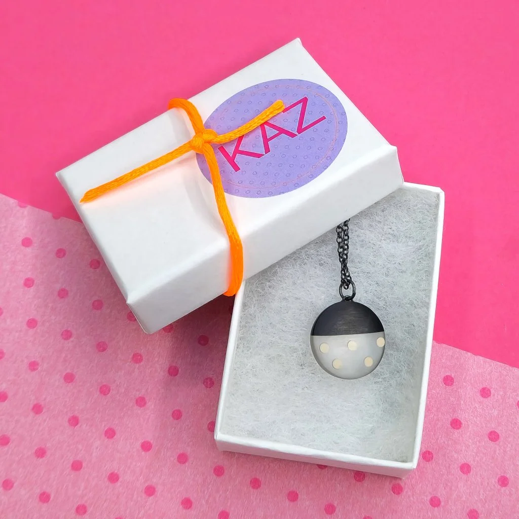 nude-spots-black-resin-pendant.jpg