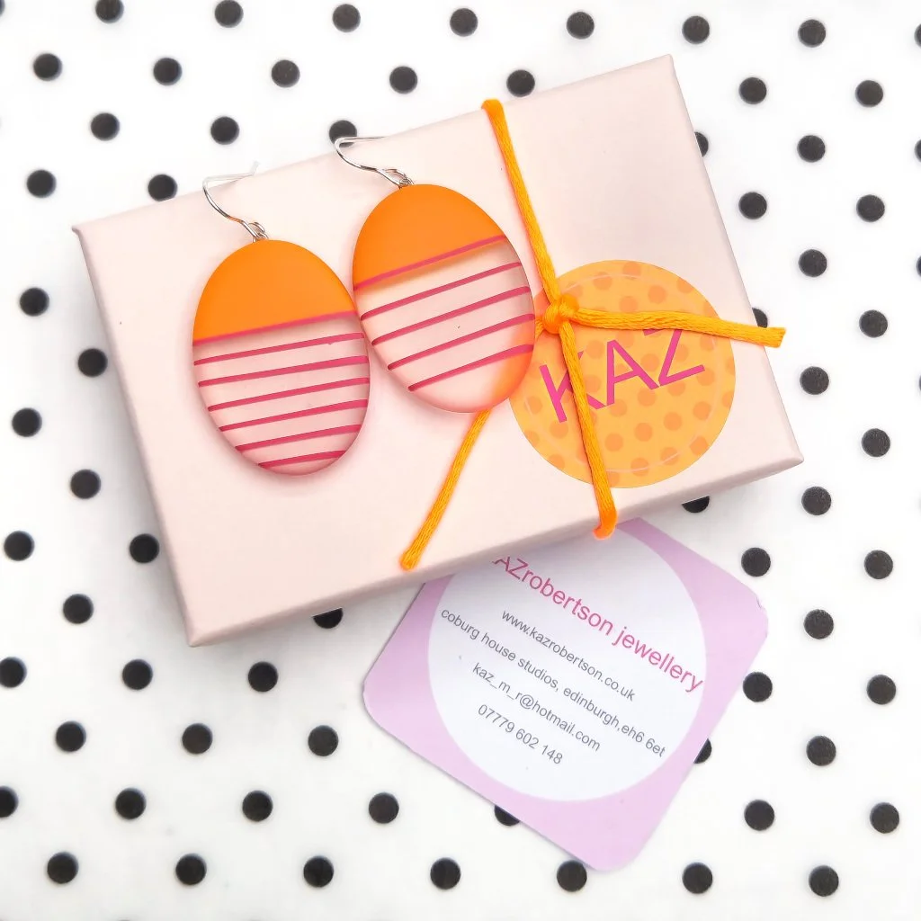 gift-wrapped-resin-oval-orange-earrings.jpg