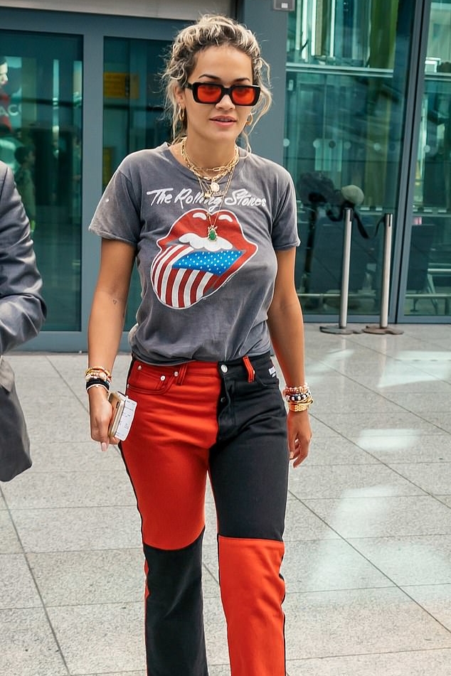 rita-ora-color-block-jeans-at-london-heathrow-airport.jpg