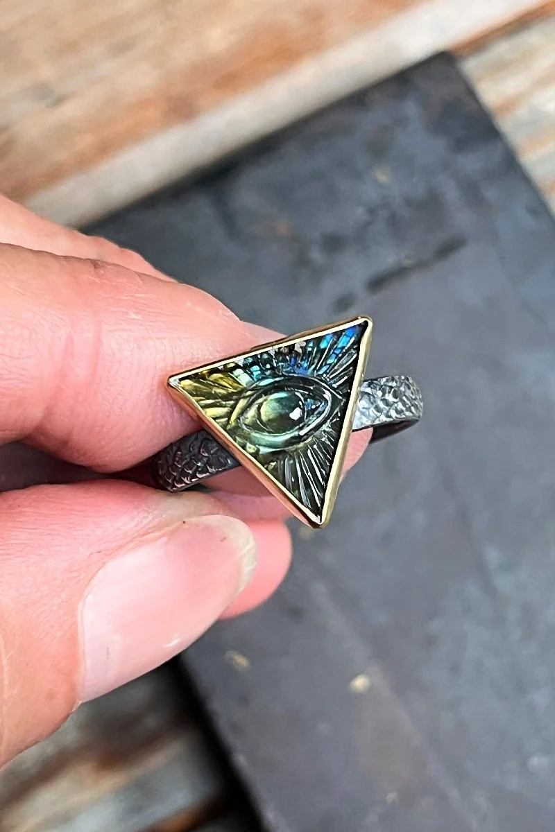 triangle_mason_eye_ring_held.jpg