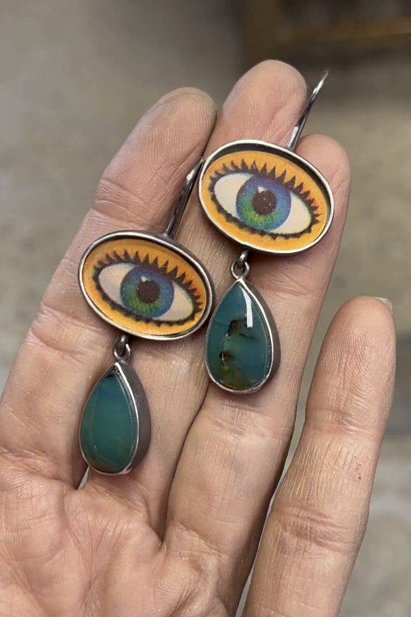blue_green_winkie_earrings_held.jpg