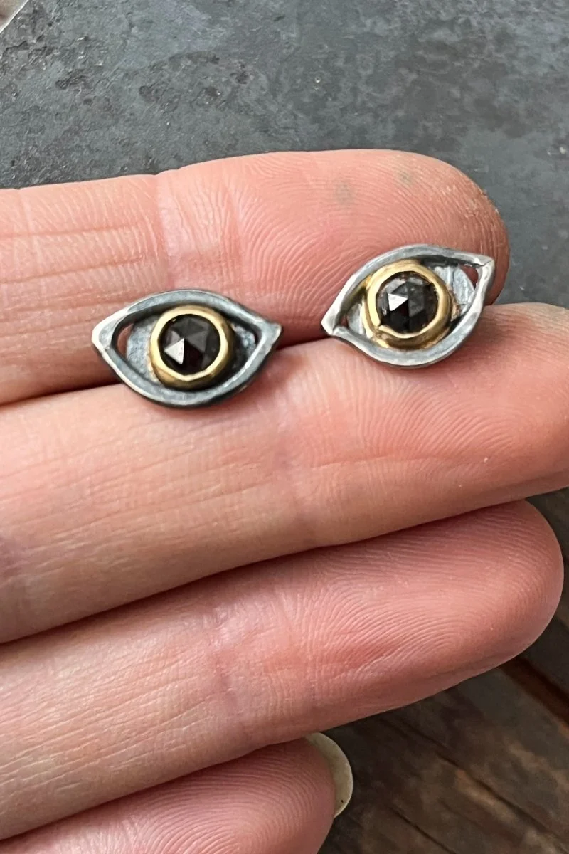 diamond_eye_studs_held.jpg