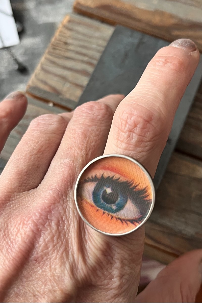 round_blue_eye_ring_worn.jpg
