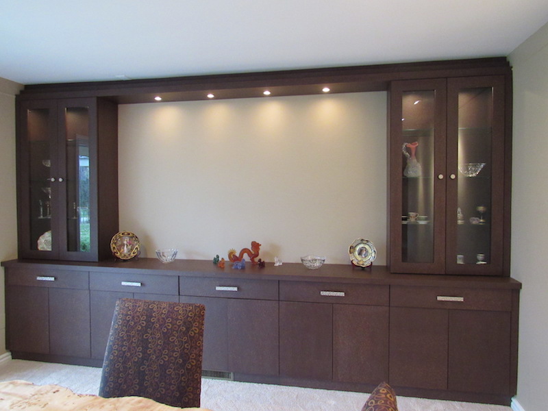 This wall-to-floor ceiling unit offers tons of storage and lots of lighted display! The open center can house a large-screen TV or more artwork.
