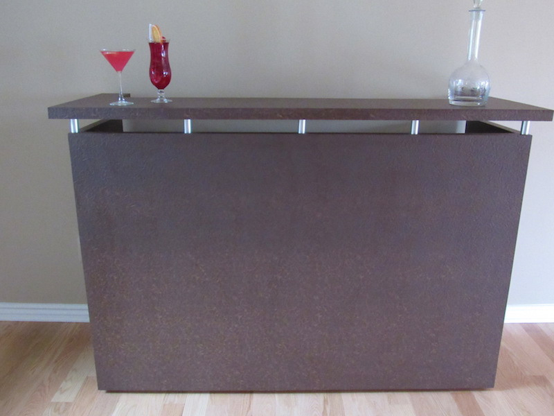 This wonderful bar is on casters so it can be moved to any part of the home when you are entertaining! There is a lot of storage on the opposite side with locked cabinets.