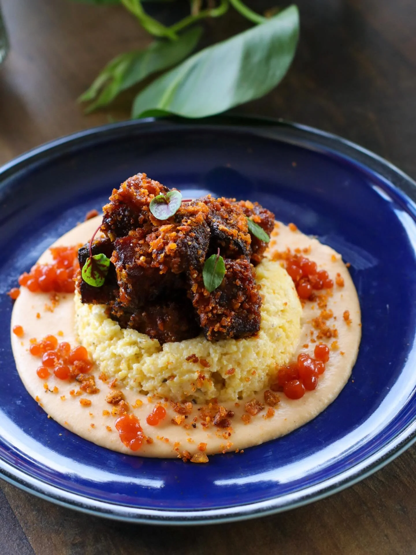Pork belly burnt ends with hot peach barbecue sauce, NC heirloom grits, apple cider faux caviar, tostone crumble, &amp; micro sorrel from @sunshinecovefarm ✨

Our patio is open for reservations! Come enjoy this beautiful weather with us. 

#blowingro