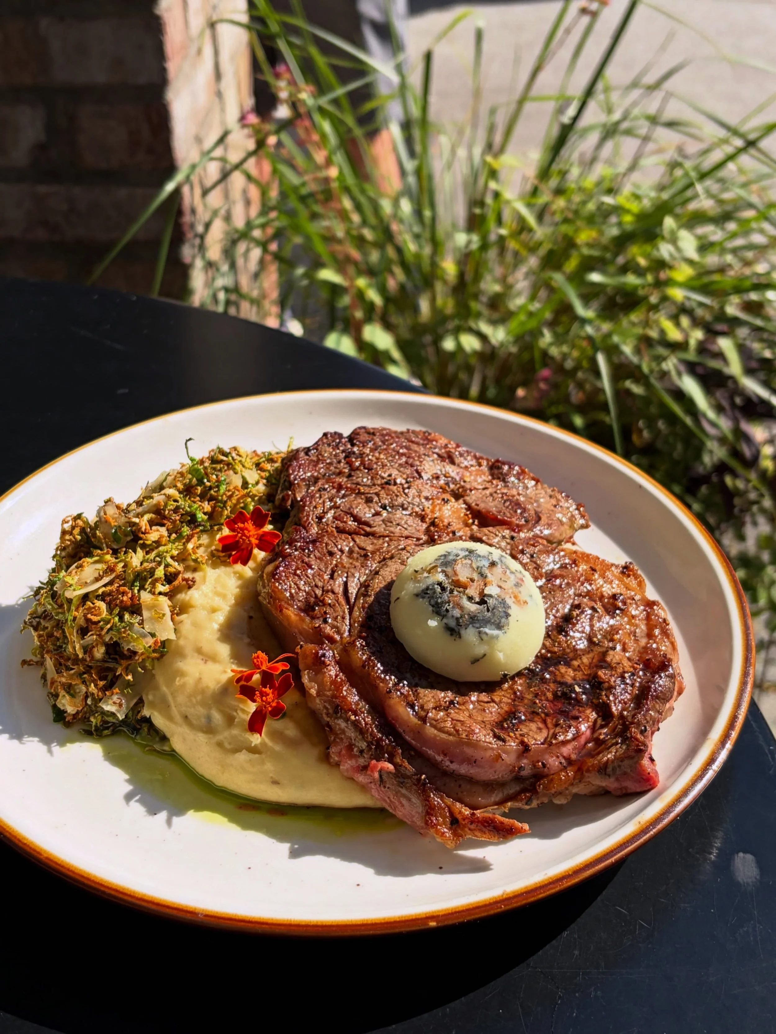 12oz Ribeye with @hedgefamilyfarm black garlic mash, shaved brussels &amp; parm salad, thyme &amp; garlic tallow butter, and herb oil&mdash;

We&rsquo;ll be running this special for dinner tonight and tomorrow! Give us a call to book reservations, co