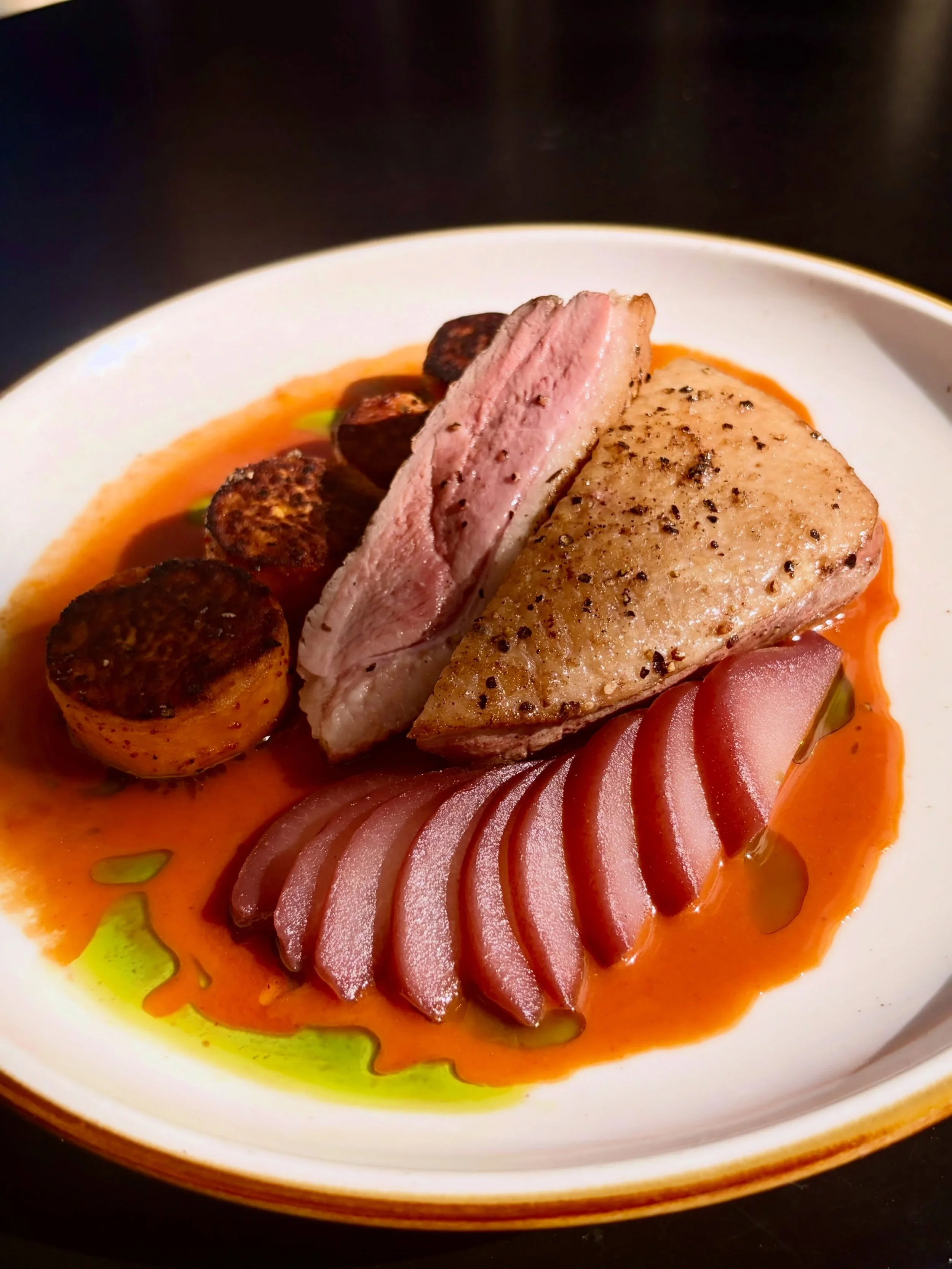 One of our seasonal dinner features! Duck Breast with red wine poached pears, roasted sweet potatoes, herb oil, &amp; gochujang demi-glac&eacute;. 

Take in this beautiful weather with us on our covered patio!! Call ahead seating is available at lunc