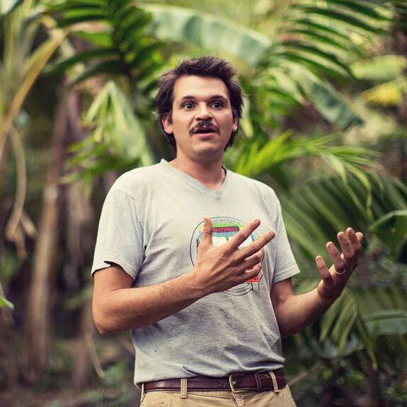 Shad Qudsi — Executive Director, WELLKIND GuatemalaShad is a passionate farmer, designer, and permaculturalist. He has lived and worked in Tzununa, Guatemala, for the past 12 years, where he and his wife founded Atitlan Organics, a permaculture-inspired organic farm. He believes that humans can live harmoniously on the planet and meet all their needs while actually enhancing the local and global ecology. After spending years practicing regenerative food production, Shad began partnering with a wide range of local farmers and community members. Shad's current role as Program Director of WELLKIND Guatemala enables him to build community-driven, permaculture-inspired solutions to food security, climate change, and economic disparity.