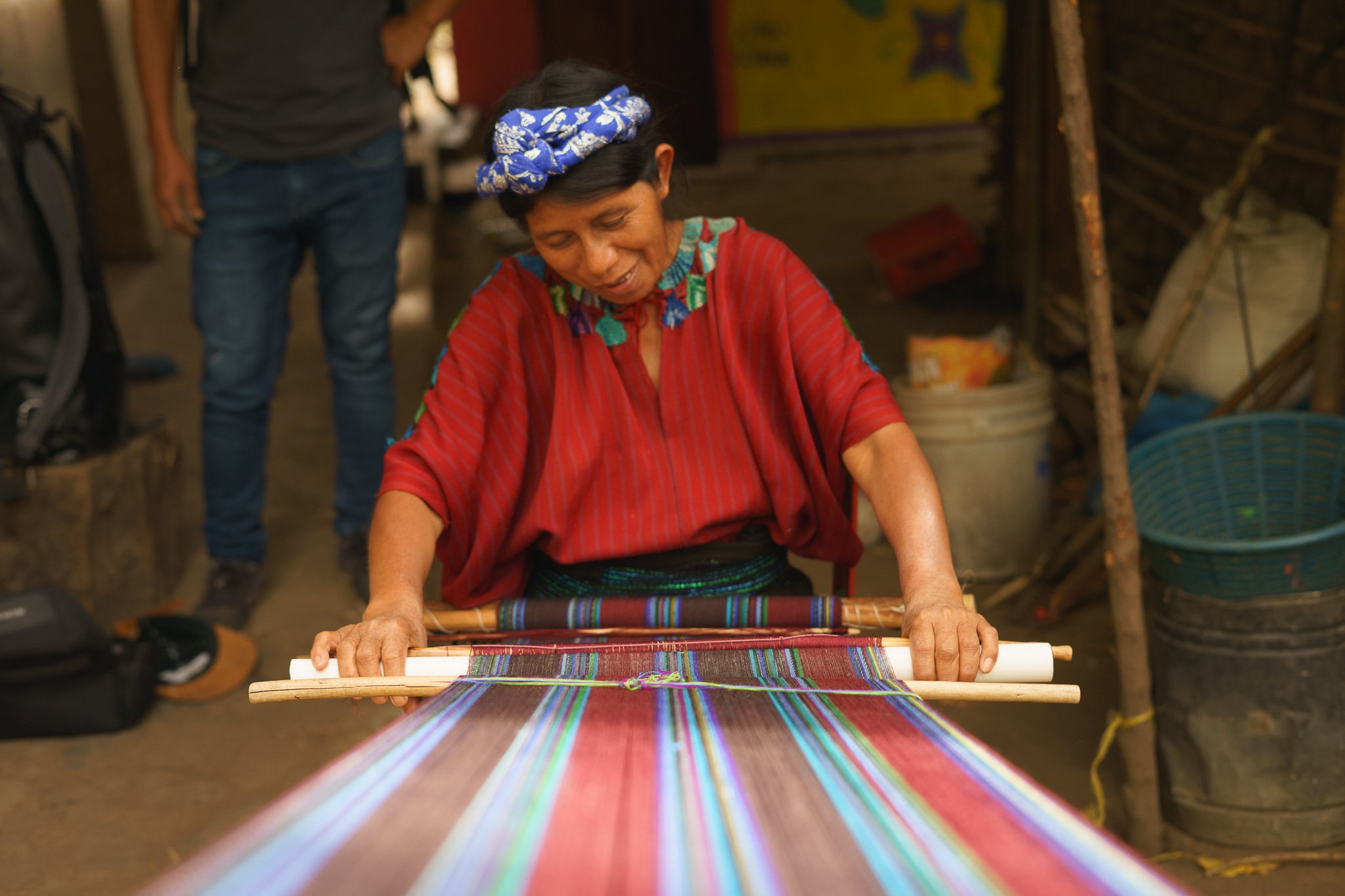 A local artisan sits at her backstop loom to produce the weaving that she is wearing, this is how most indigenous women in Guatemala make their clothing. .jpg