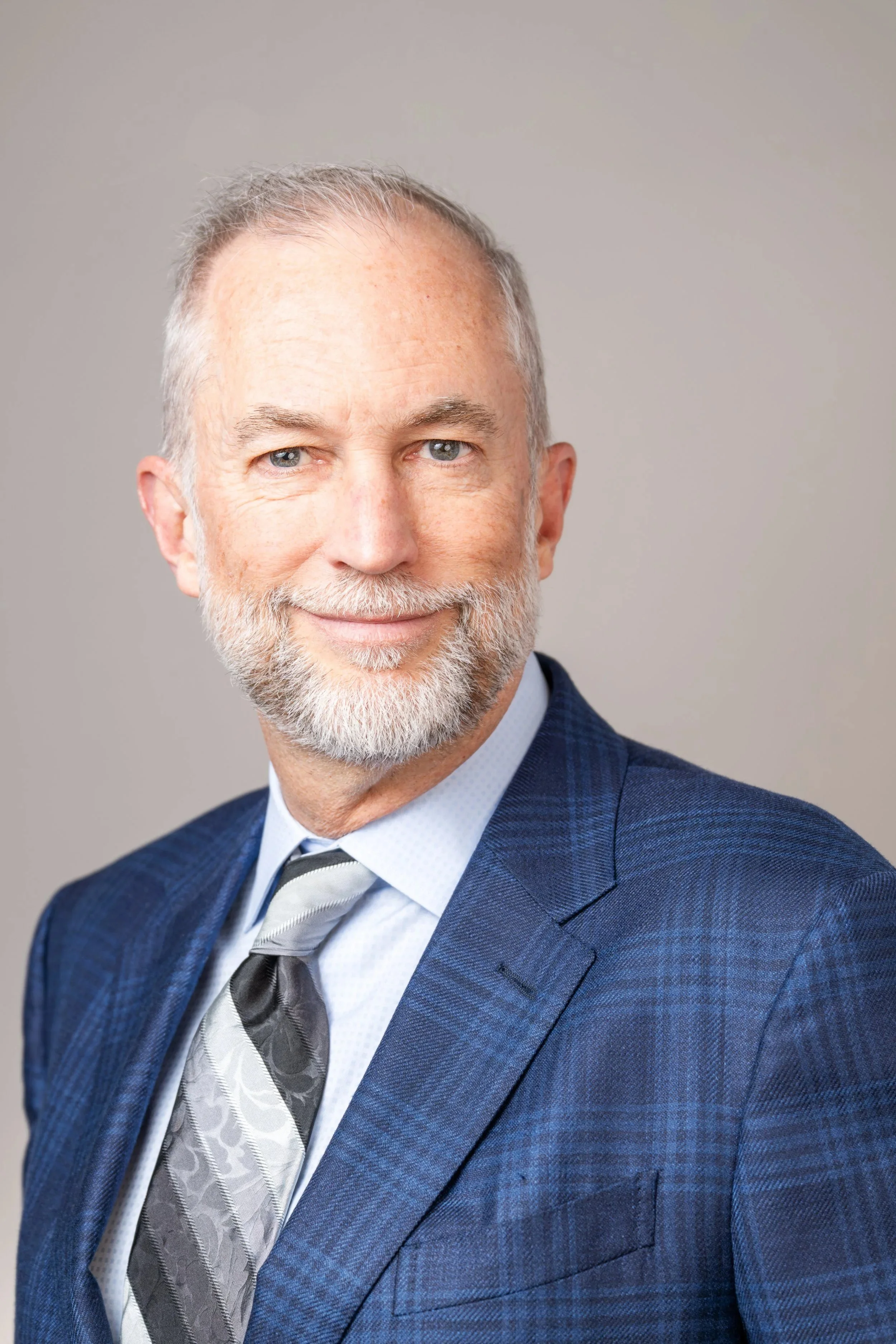 Portrait of attorney at Goldman Newman and Hamilton LLP on savage seamless gray backdrop