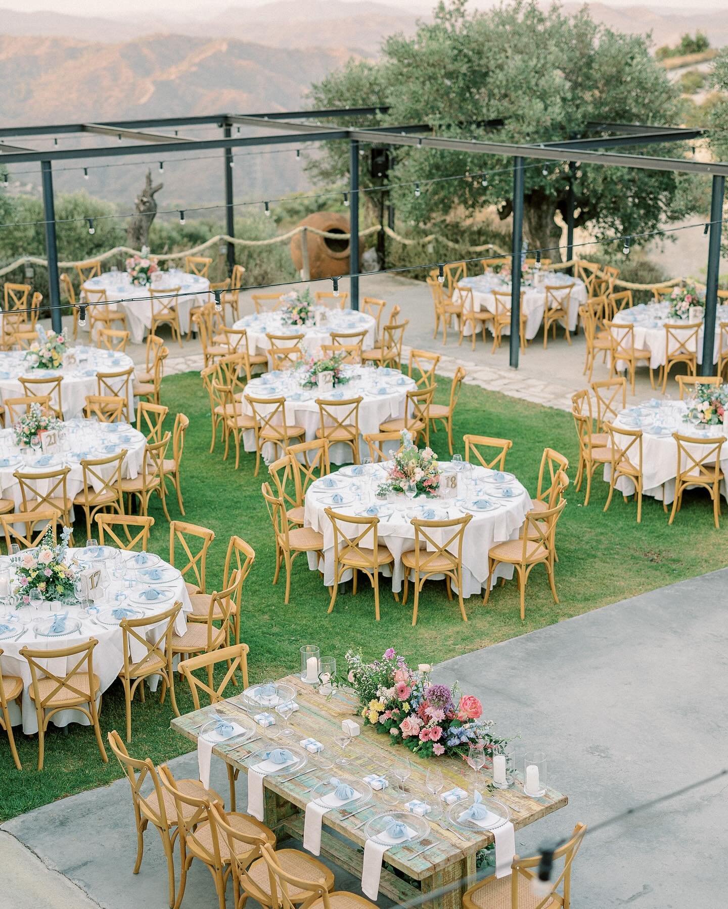 Cheers to love blossoming like vibrant summer flowers amidst the picturesque vineyards of @dafermouwinery at Lefkara, Cyprus. Raising a glass to the incredible team of @missplanner_events who orchestrated every detail flawlessly, turning dreams into 
