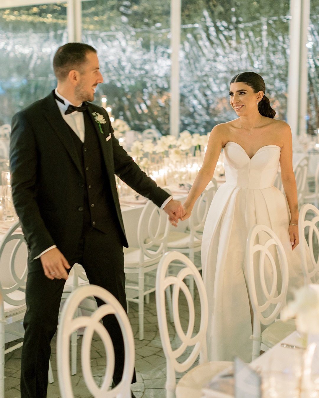 From the first button fastened in the groom&rsquo;s suite to the last dance under a sky of twinkling lights, every moment of this wedding was a dream in white. Chic details at every turn set the stage for a celebration as elegant as it was electrifyi