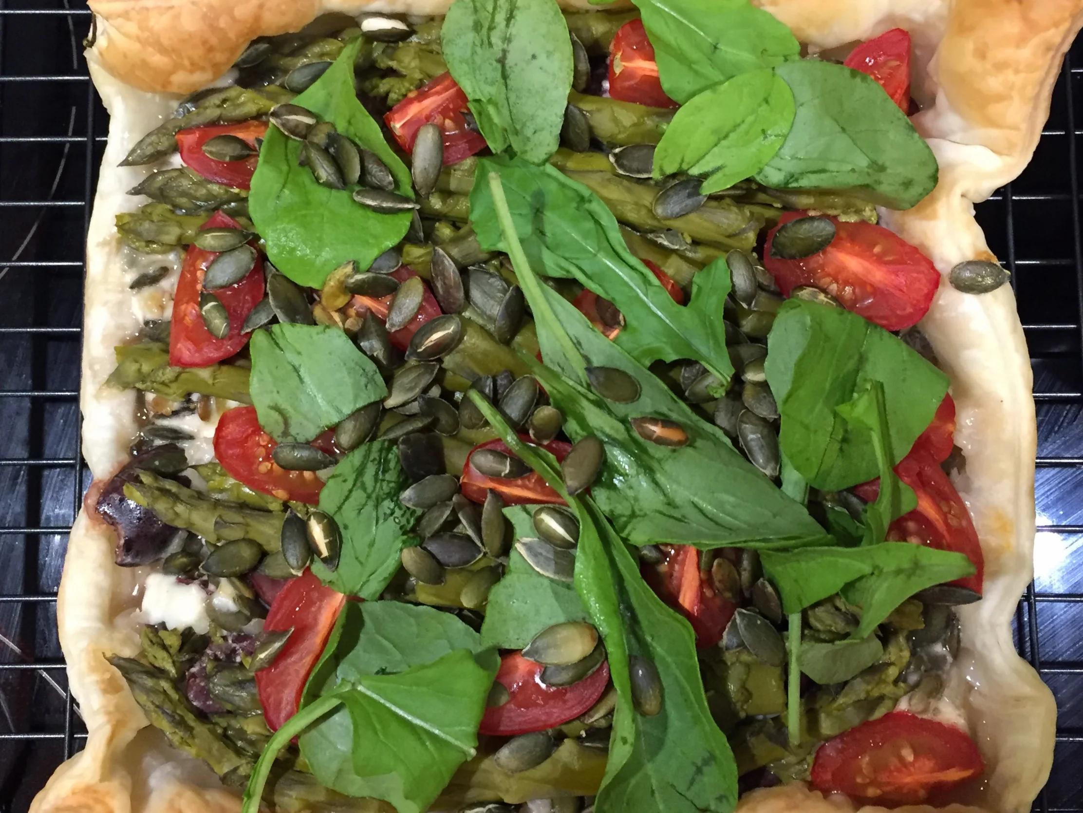 Roasted tomato, olive and asparagus tart