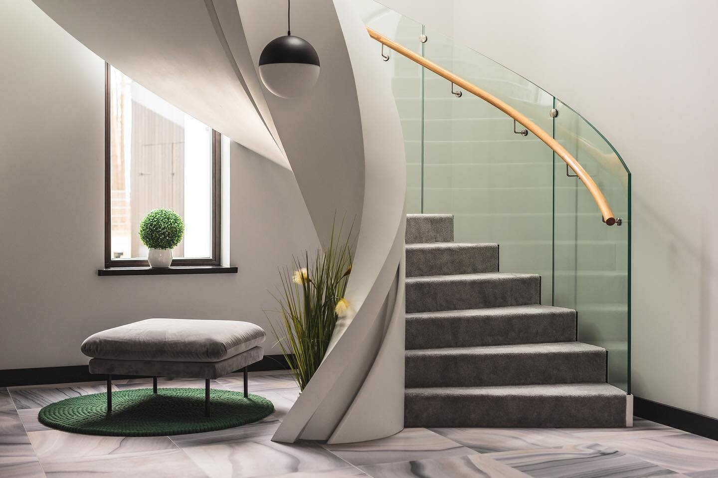 Modern custom design #curvedstairs made from steel and wrapped in carpet to make it warmer for children to run up and down in the mornings. #stairsdesign was created by the home owners themselves and it is definitely one of a kind. Also the glass bal