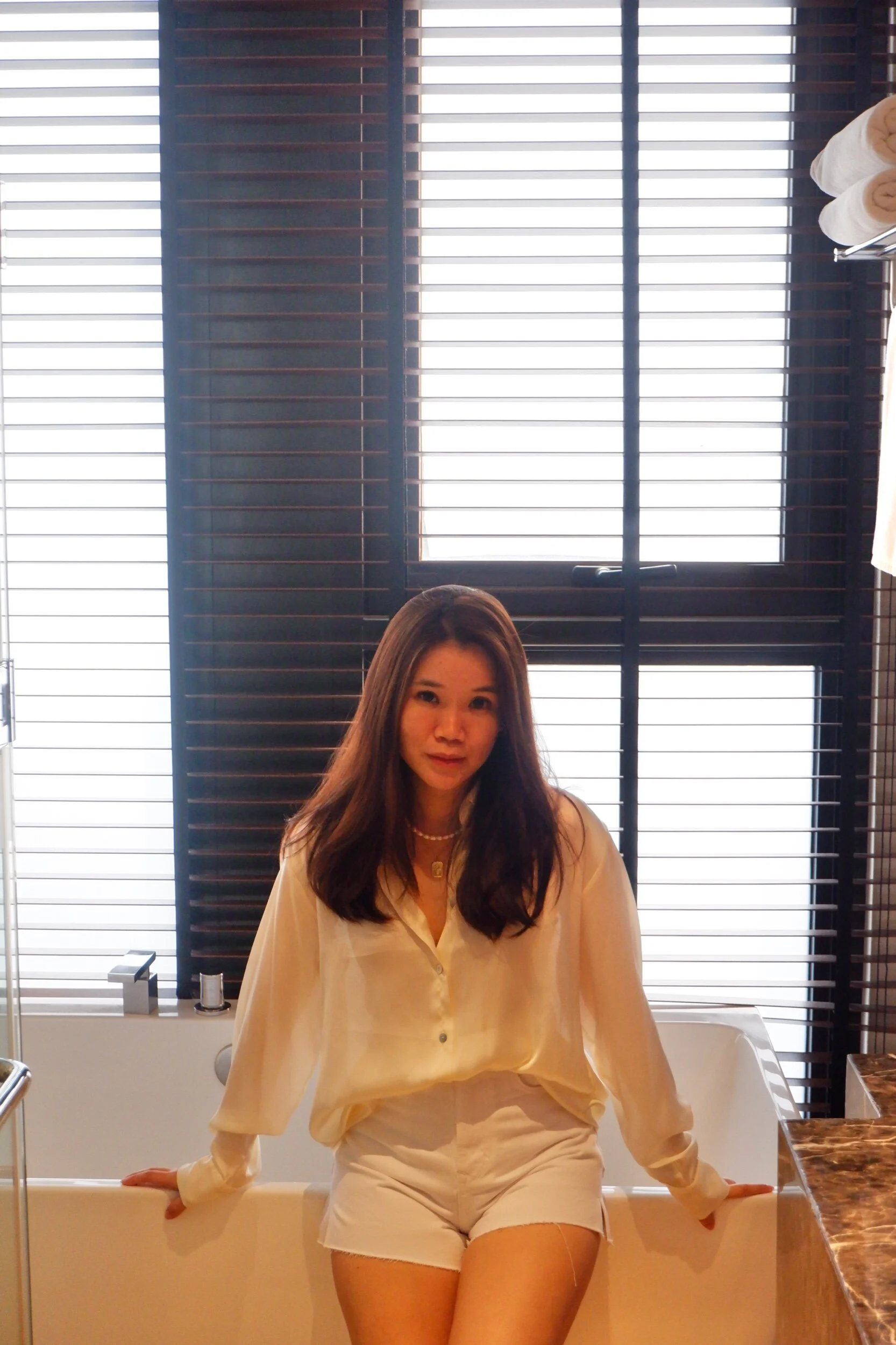 All white: satin top, white denim shorts