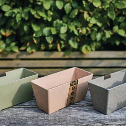made with husk herb planters