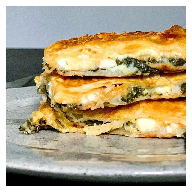 These spinach and cheese pies are light and full of flavor. A little tang from the cheese, sweetness from the spinach, and bite from the garlic, wrapped up in airy phyllo pastry. We are having it with soup tonight. Recipe link in bio. #nationalvegeta