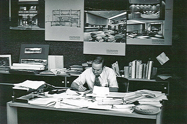 Larry at his Desk in black and white.jpg