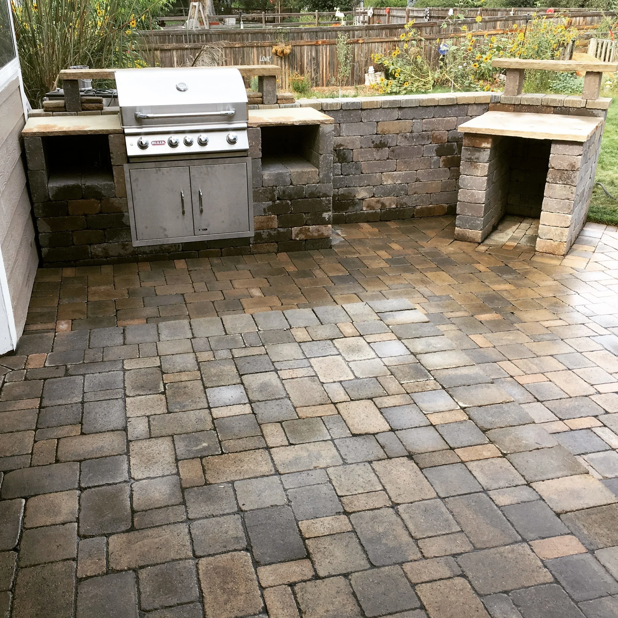 Custom outdoor kitchen on paver patio