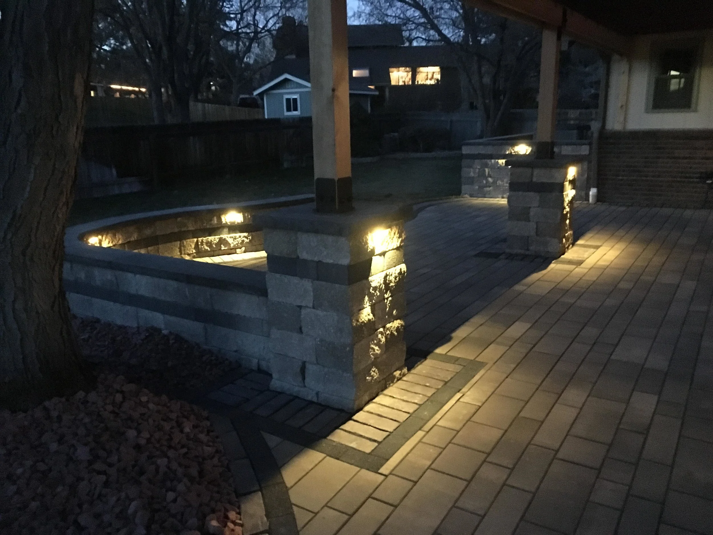 Custom paver patio at night with custom lighting