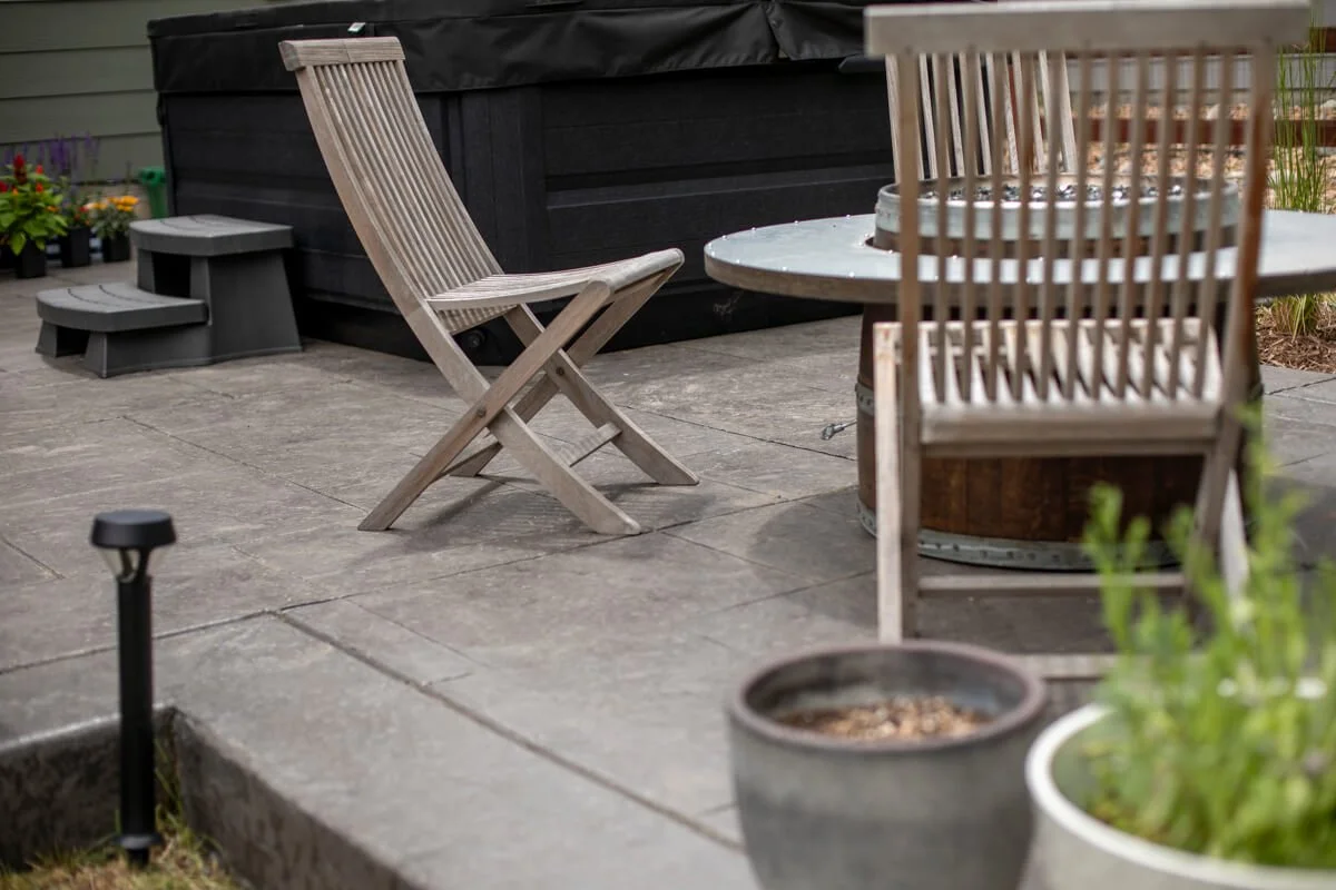 Closeup of stamped concrete and chair