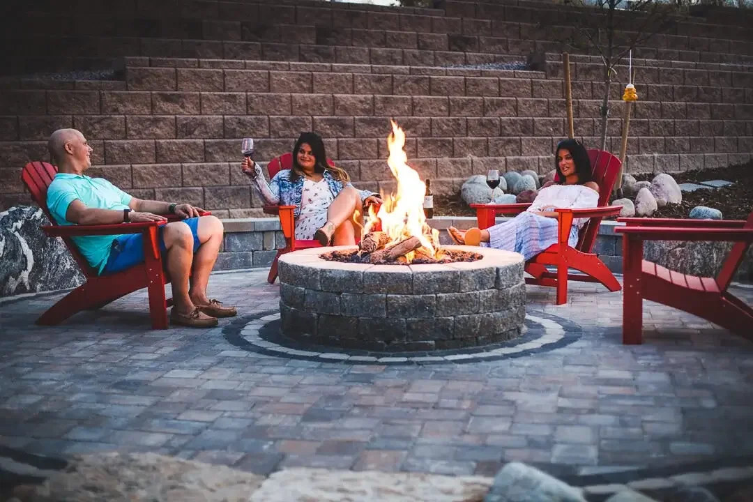 Outdoor paver patio with curved lines and circular fire pit