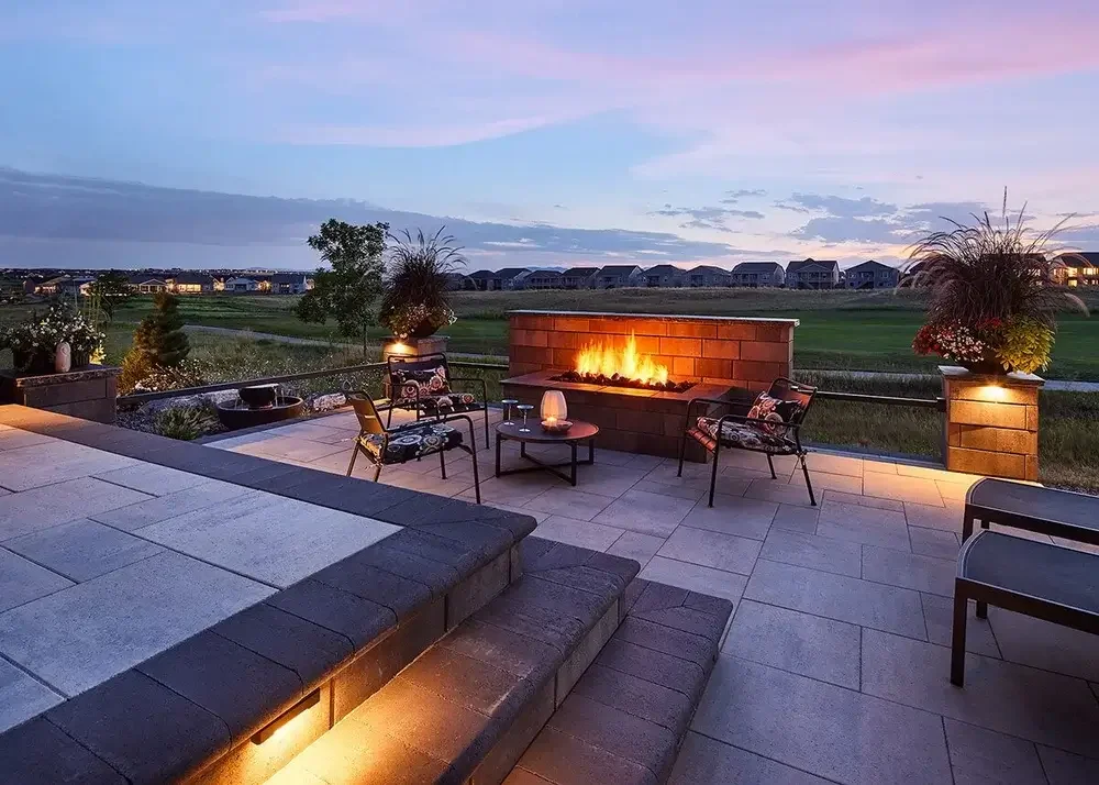Modern patio at dusk with lights off of golf course
